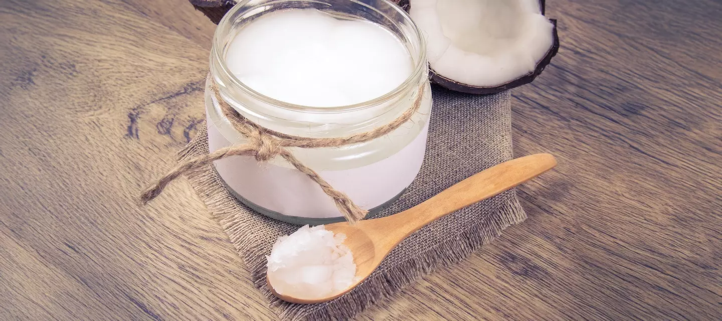 Coconut oil on a spoon for oil pulling